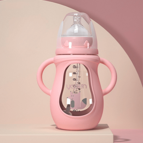 un biberon anticolique rose