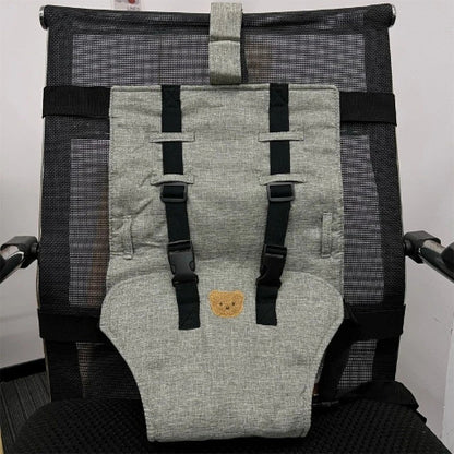 siège à harnais installée sur une chaise de bureau 